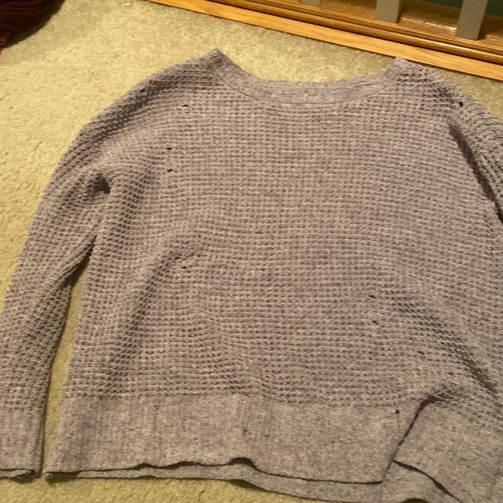 Distressed sweater.